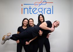 The Integral kinesiologists standing in front of the Integral sign